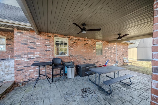 view of patio featuring ceiling fan