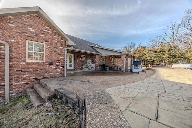 rear view of house featuring a patio