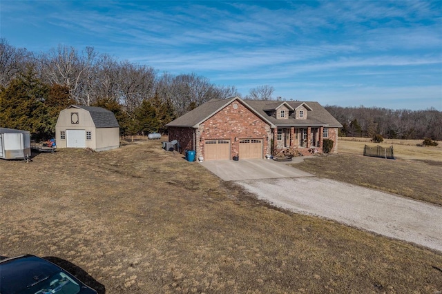 view of front of property with a storage shed and a front lawn