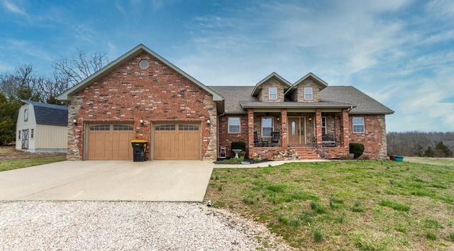 view of front of home featuring a garage, covered porch, and a front lawn