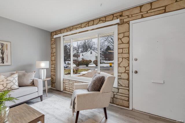 sitting room with light hardwood / wood-style floors