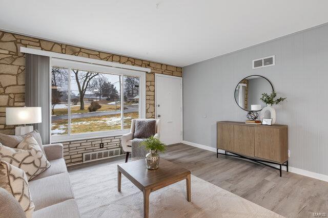 living room with light hardwood / wood-style flooring