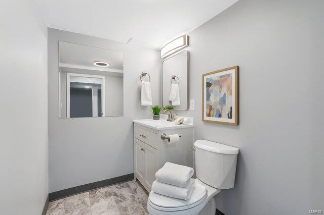 bathroom with vanity and toilet