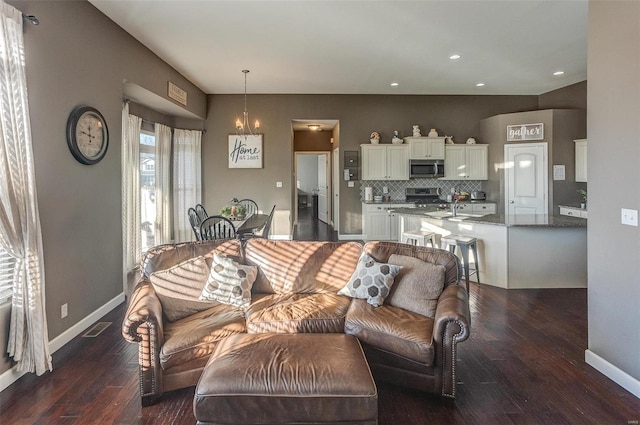 living room featuring dark wood-type flooring