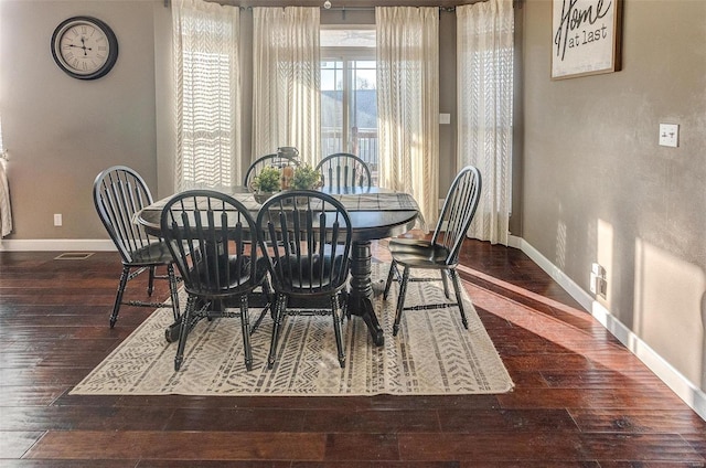 dining room featuring dark hardwood / wood-style flooring