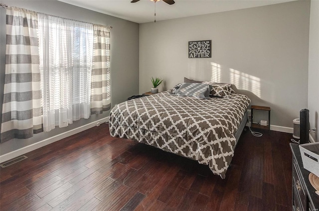 bedroom featuring dark hardwood / wood-style floors and ceiling fan