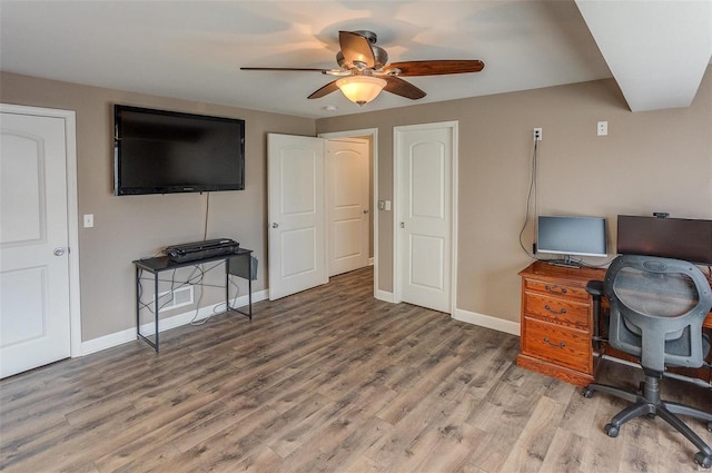 office featuring wood-type flooring and ceiling fan