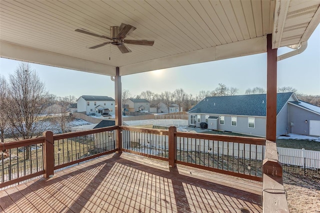 wooden deck featuring ceiling fan