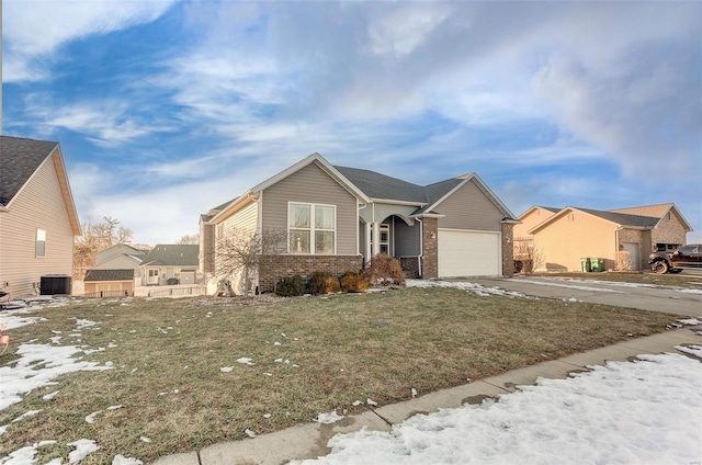 view of front of property featuring a garage and a front yard