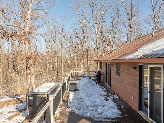 snow covered deck with area for grilling