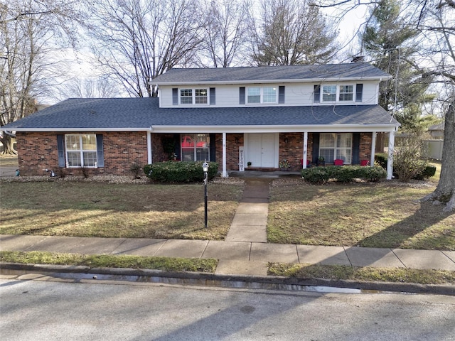 front of property featuring a front yard and a porch