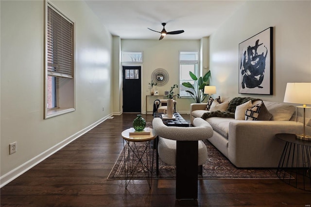 living room with ceiling fan and dark hardwood / wood-style flooring