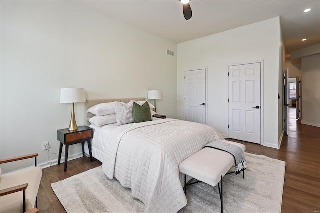 bedroom featuring dark hardwood / wood-style floors and ceiling fan