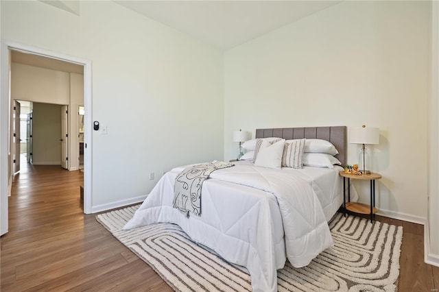 bedroom with wood-type flooring