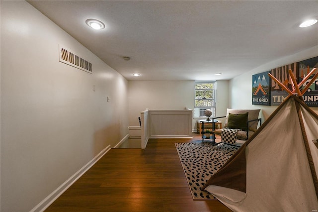 corridor featuring dark hardwood / wood-style floors