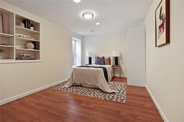 bedroom with hardwood / wood-style floors