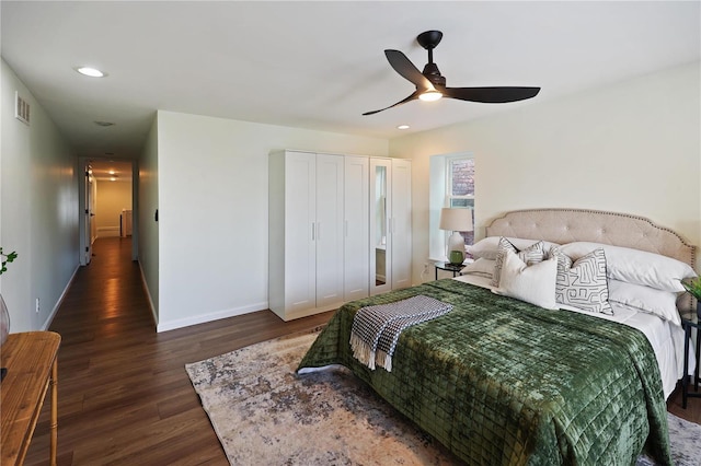 bedroom with dark wood-type flooring and ceiling fan