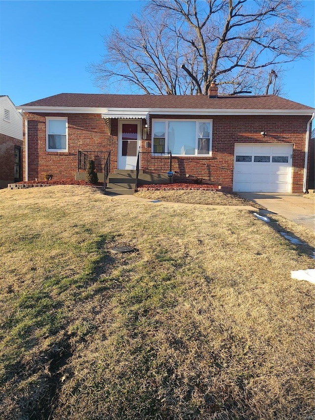 single story home with a garage and a front yard