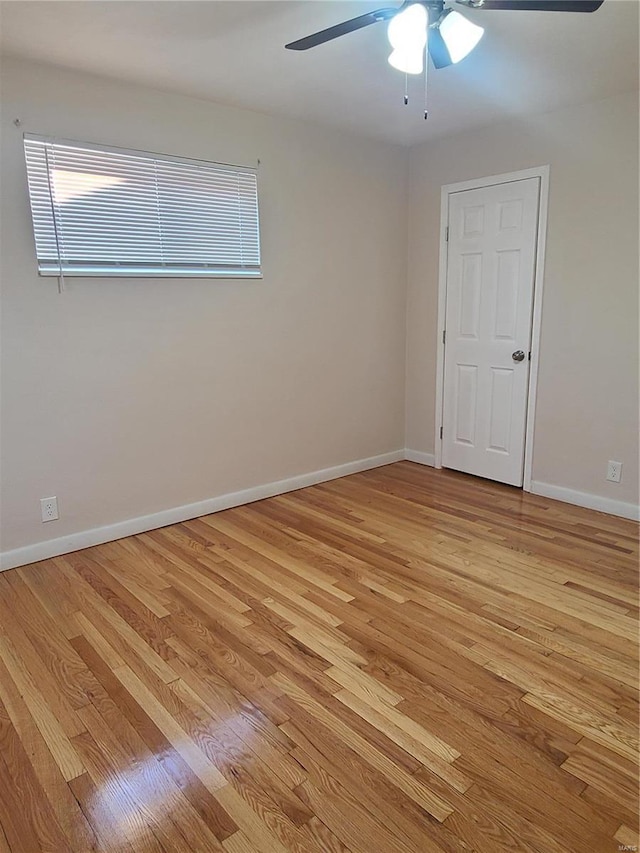 spare room with light hardwood / wood-style floors and ceiling fan