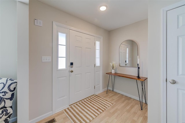 entrance foyer with light wood-type flooring