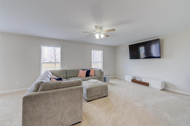 living room featuring light colored carpet and ceiling fan