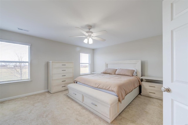 bedroom with light colored carpet and ceiling fan