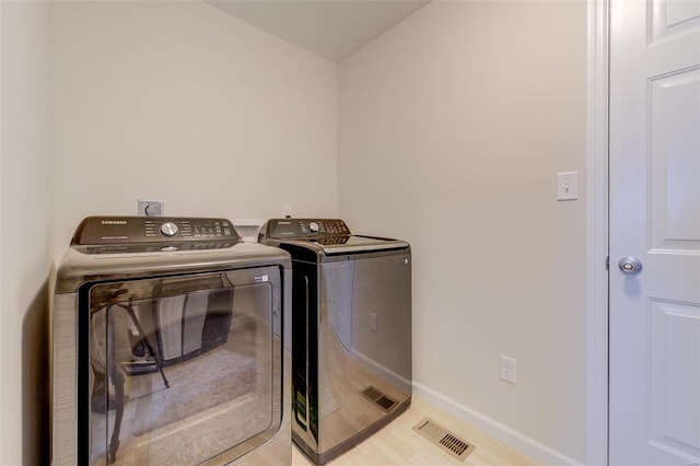 laundry area featuring washing machine and dryer