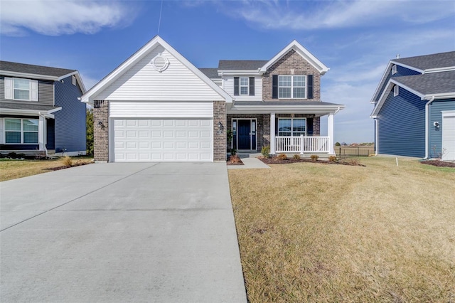 front facade with a garage, a front lawn, and covered porch