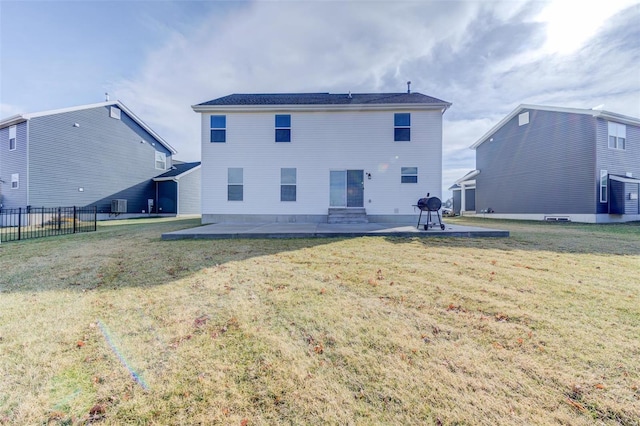 back of property featuring a patio area and a lawn