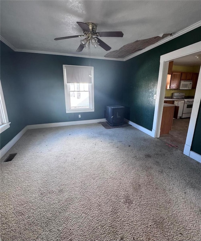 unfurnished room featuring crown molding, carpet floors, a textured ceiling, and ceiling fan