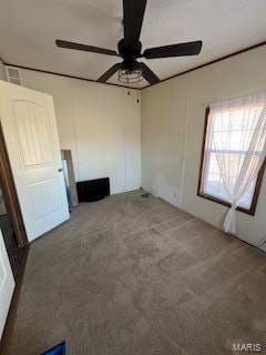 empty room featuring ceiling fan and carpet flooring