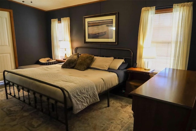 bedroom featuring crown molding