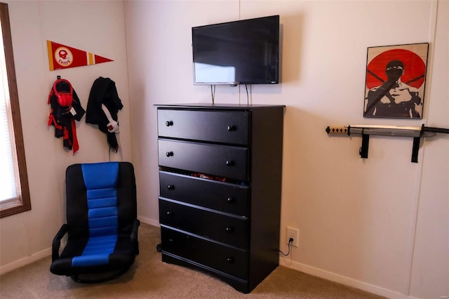 carpeted bedroom featuring baseboards