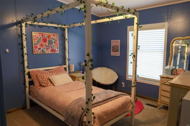 carpeted bedroom with visible vents and baseboards