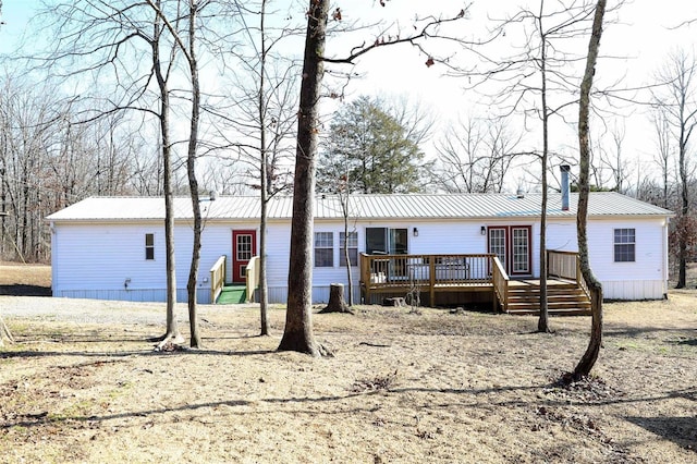 manufactured / mobile home featuring a deck and metal roof