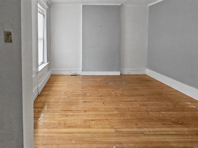 empty room featuring plenty of natural light and light wood-type flooring