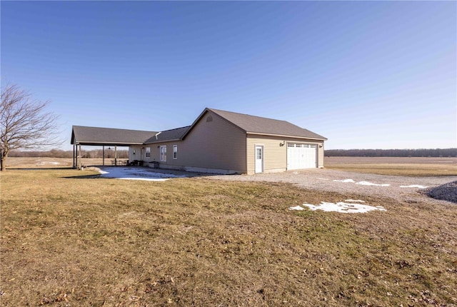 exterior space featuring a yard and a rural view