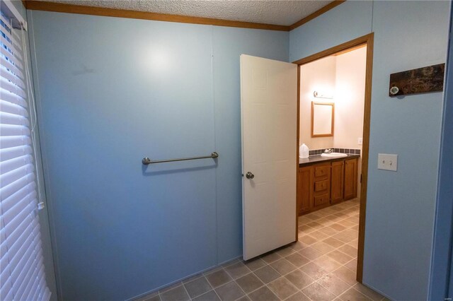 bathroom featuring vanity and a textured ceiling