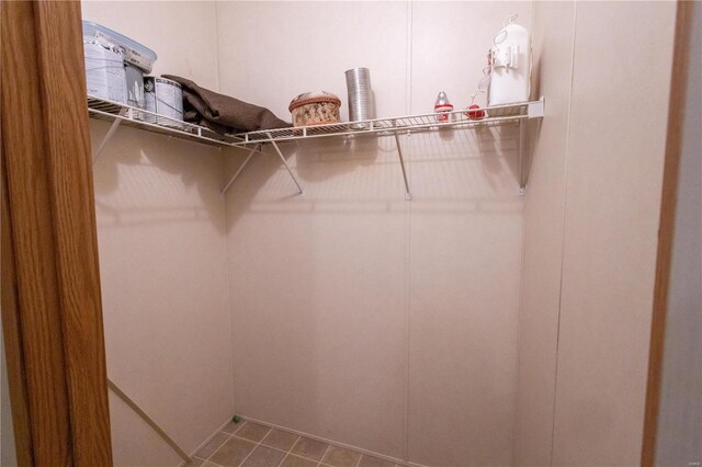 spacious closet with tile patterned flooring