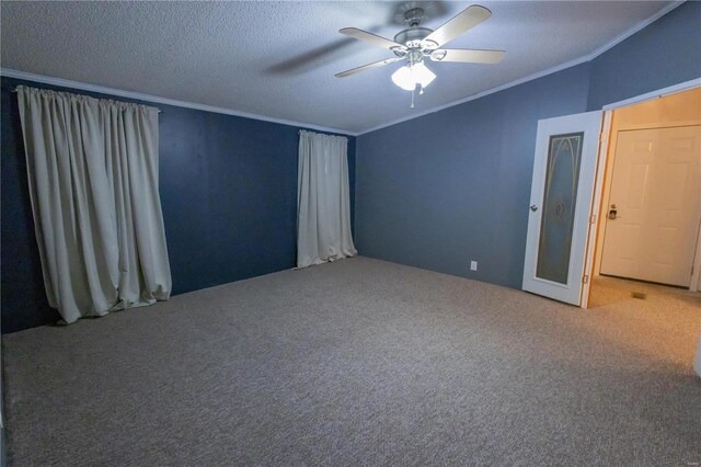 unfurnished bedroom with ceiling fan, ornamental molding, a textured ceiling, and carpet