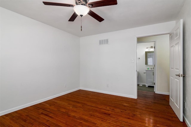 unfurnished room featuring ceiling fan and dark hardwood / wood-style floors