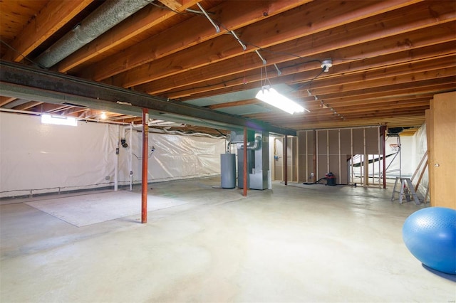 basement featuring gas water heater and heating unit