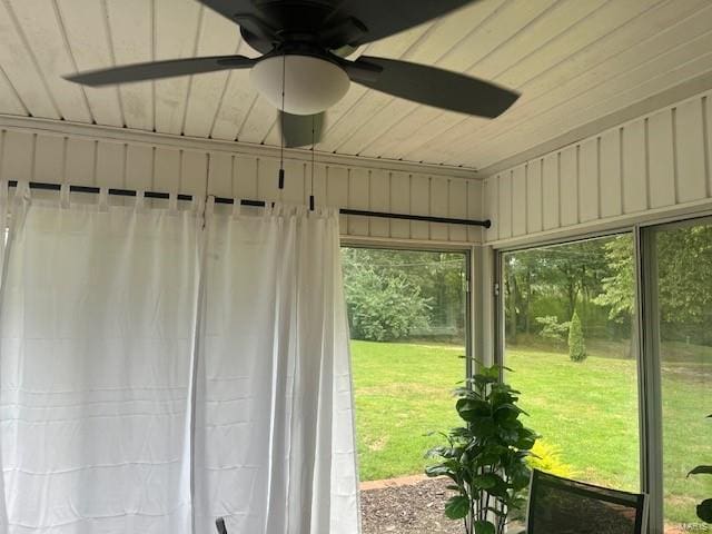 unfurnished sunroom featuring wooden ceiling and ceiling fan