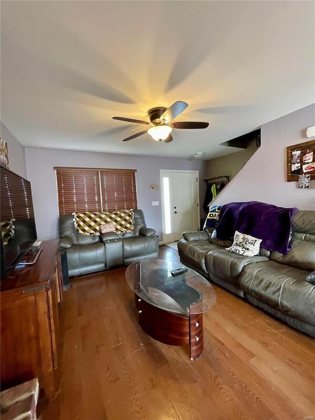 living room with ceiling fan and hardwood / wood-style floors