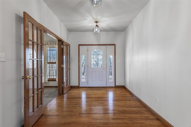 entrance foyer with wood-type flooring and french doors