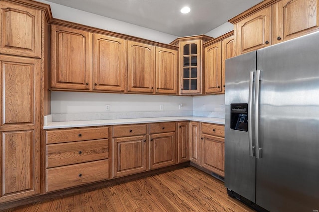 kitchen featuring dark wood-type flooring and stainless steel fridge