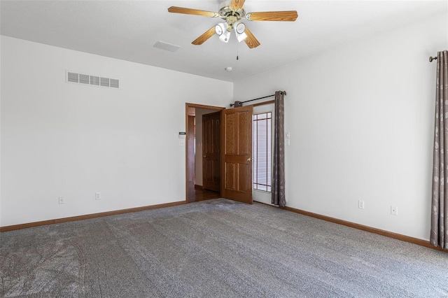 carpeted empty room featuring ceiling fan