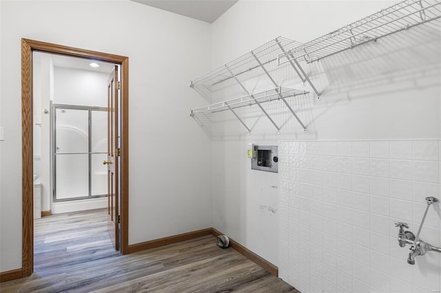 clothes washing area featuring wood-type flooring and washer hookup