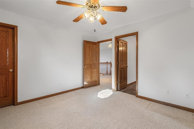 unfurnished bedroom with carpet flooring and ceiling fan