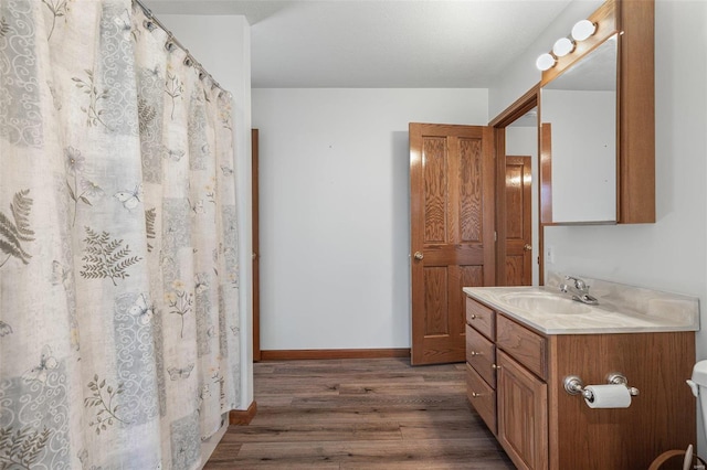 bathroom featuring vanity and hardwood / wood-style floors